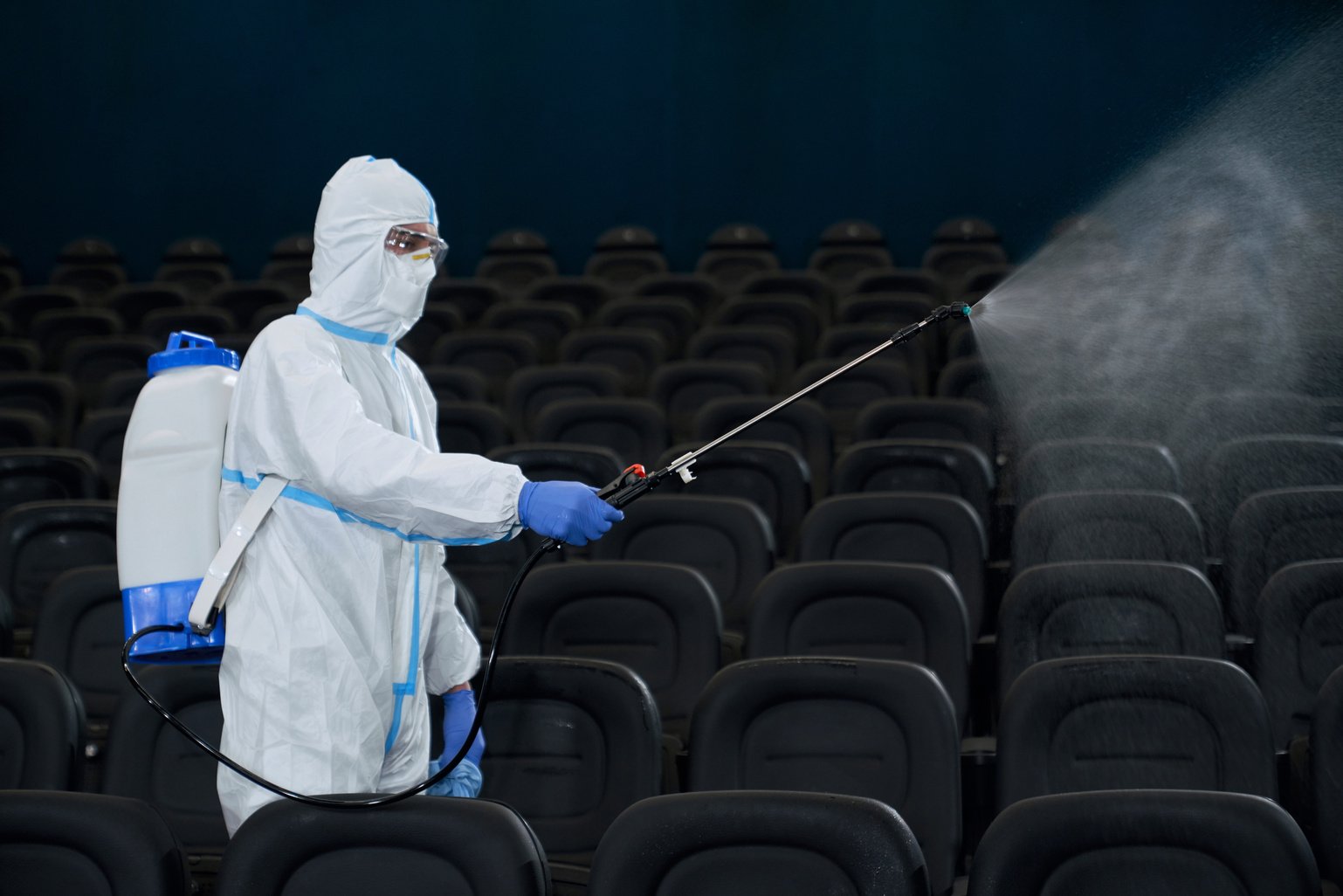 Man Holding Special Disinfection Equipment in Cinema.